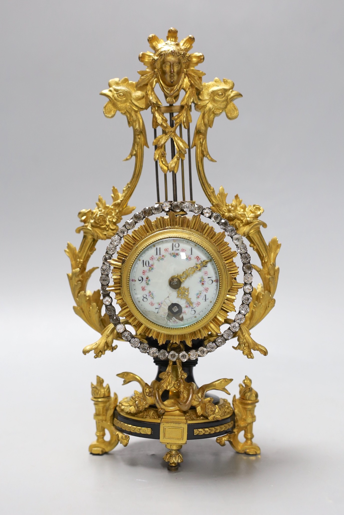 An early 20th century French ormolu mounted miniature lyre clock, 24 cm time